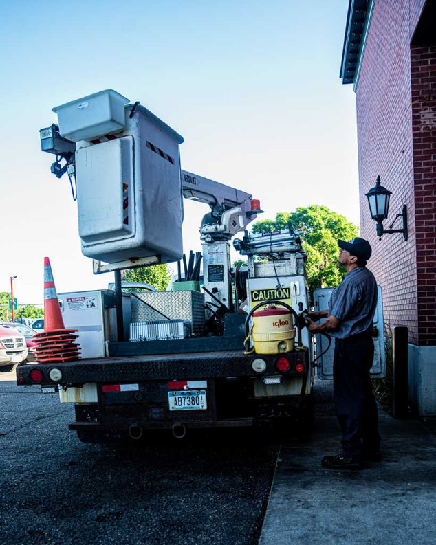 Boom truck, or bucket truck, being worked on