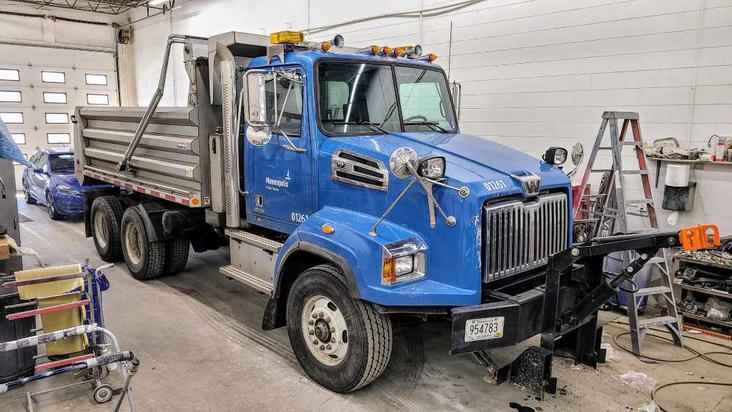 Dump truck in auto shop in New Brighton, MN