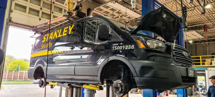 Commercial van in auto shop for maintenance and repair