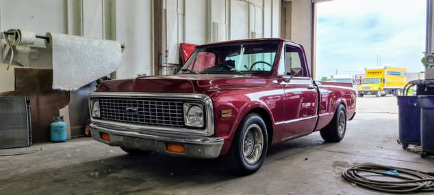 Auto vehicle being repaired in body shop