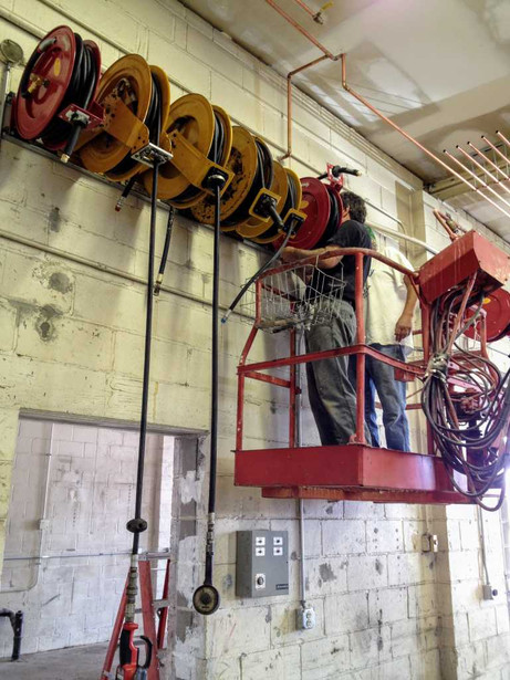 Brian installing new hose reels