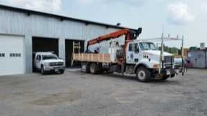 One of the two buildings used for metal fabrication and truck repairs