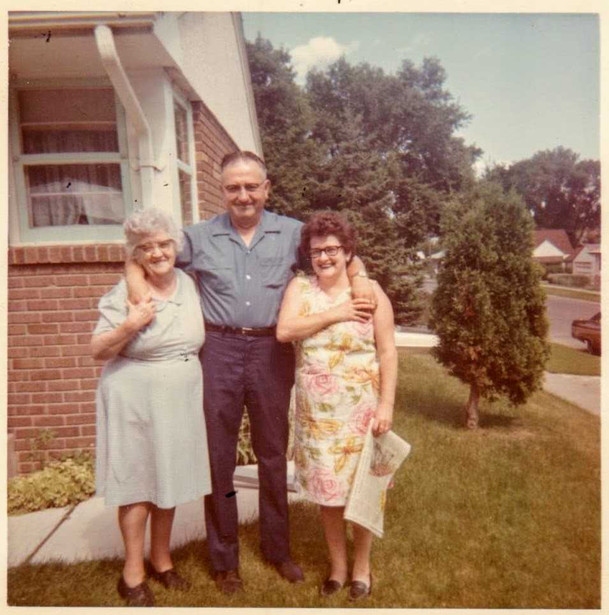Paul Bona and his sisters - note the mechanic's uniform worn even in his free time